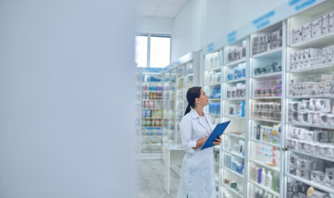 Pharmacist checking medicines in a drugstore